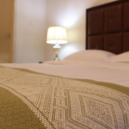 Qingdao Elegant Central Apartment Екстер'єр фото