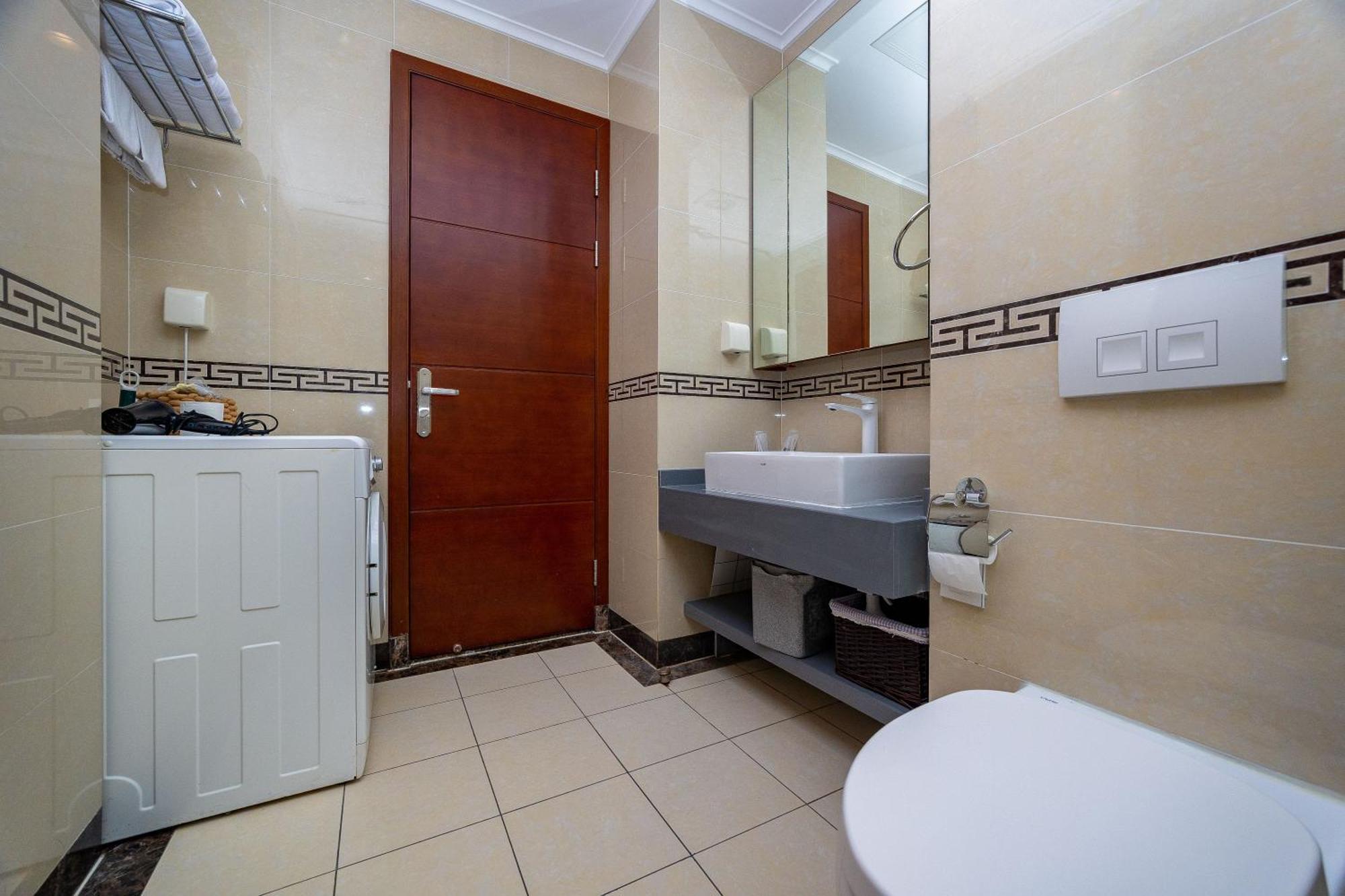 Qingdao Elegant Central Apartment Екстер'єр фото