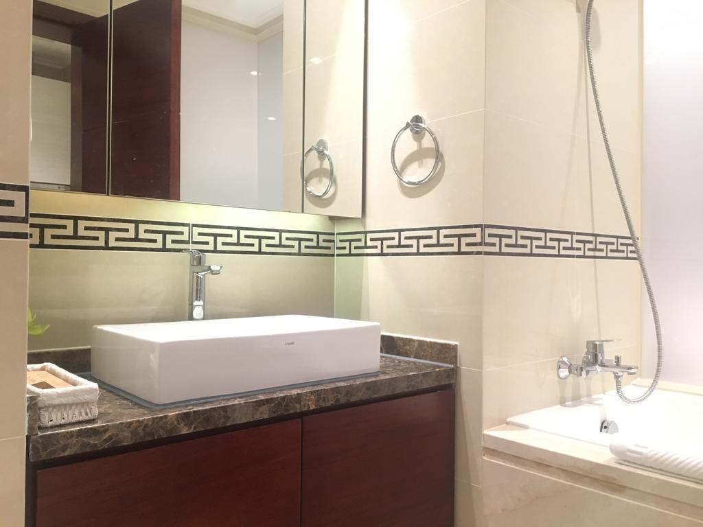 Qingdao Elegant Central Apartment Екстер'єр фото