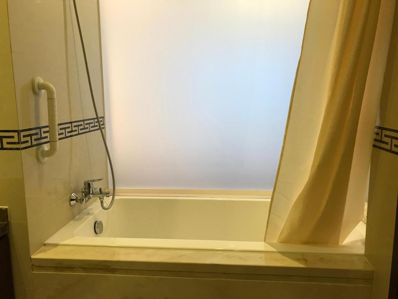 Qingdao Elegant Central Apartment Екстер'єр фото